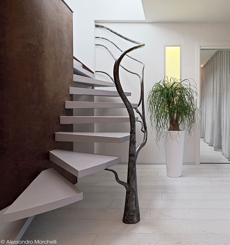 Tree-Like Sculpture Acts As A Railing For These Stairs