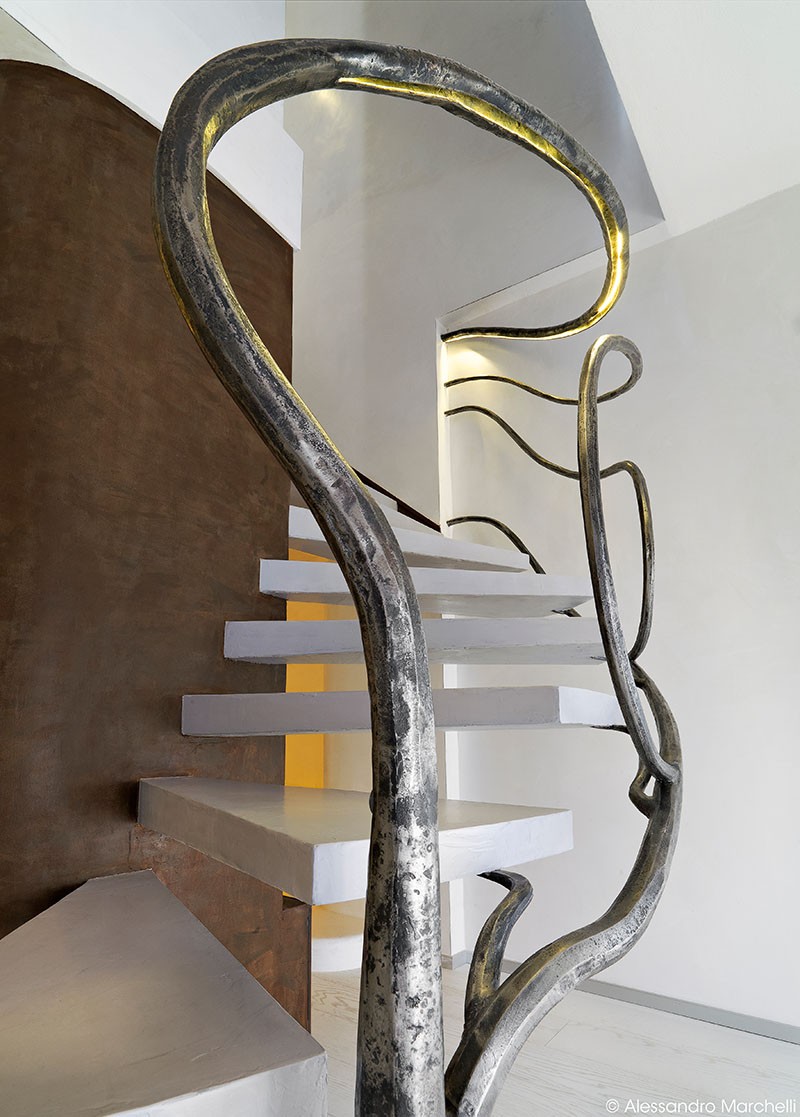 Tree-Like Sculpture Acts As A Railing For These Stairs