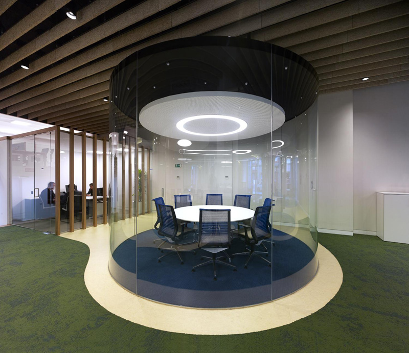 MVN Architects Design Transparent Glass Cylinder Meeting Rooms