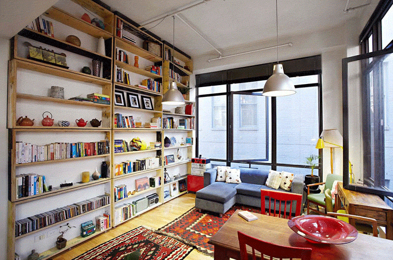 The UnWaste Bookcase, a sustainably designed full-wall rotating library.