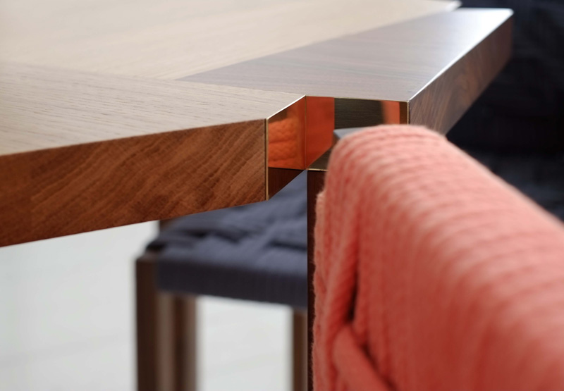 Woven Angled Seating Fits Snugly Into Notched Out Sections On This Table