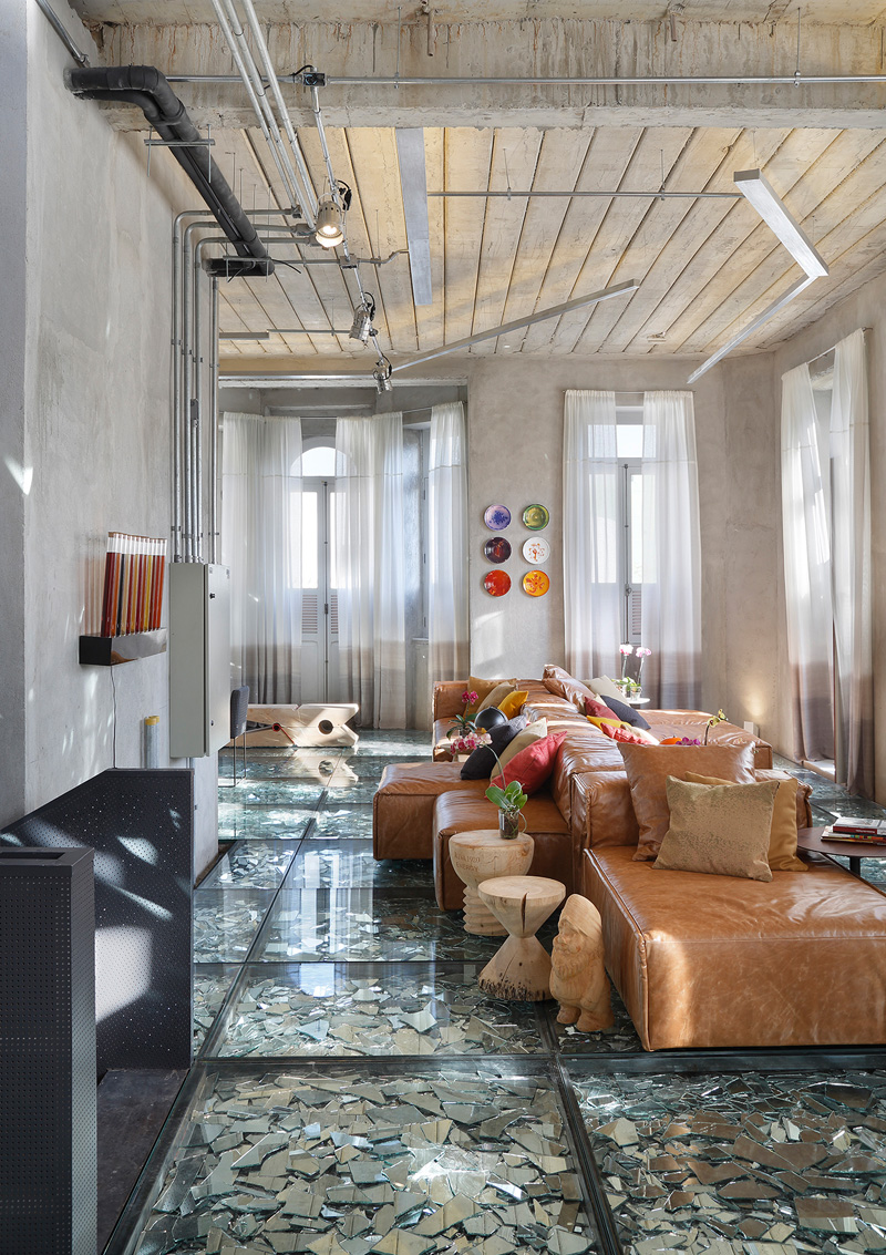 This Interior Has A Suspended Glass Floor Filled With Mirror Shards