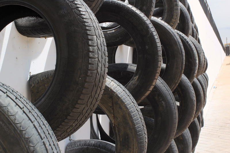 An Artistic Recycled Tire Installation Covers A Wall In Spain