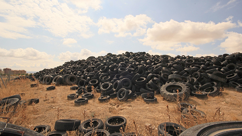 An Artistic Recycled Tire Installation Covers A Wall In Spain