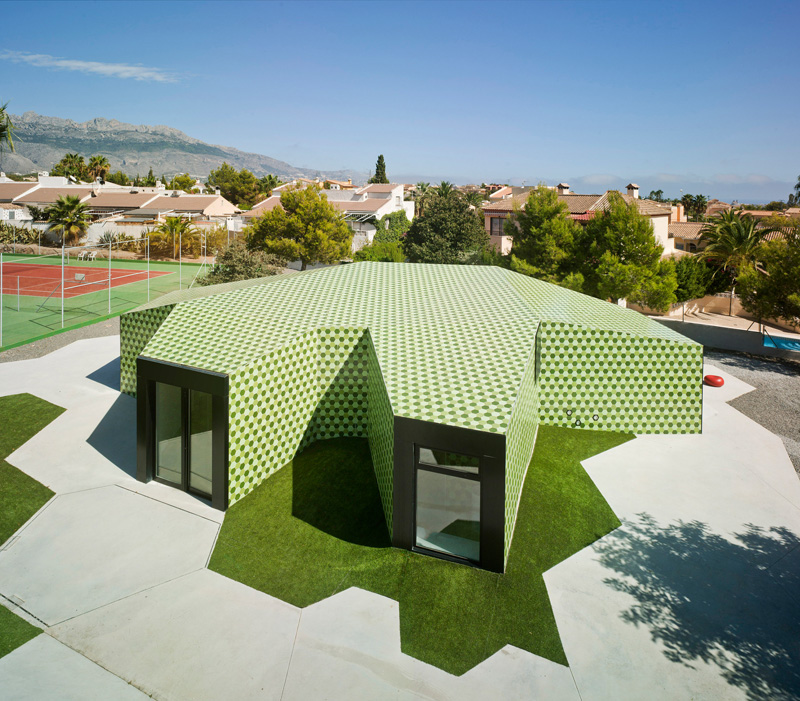An Administrative Building In Spain Is Covered In Thousands Of Green Hexagonal Tiles
