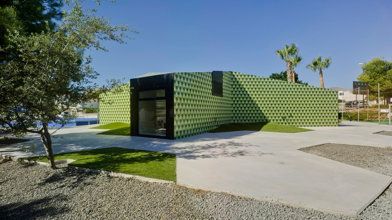 An Administrative Building In Spain Is Covered In Thousands Of Green Hexagonal Tiles