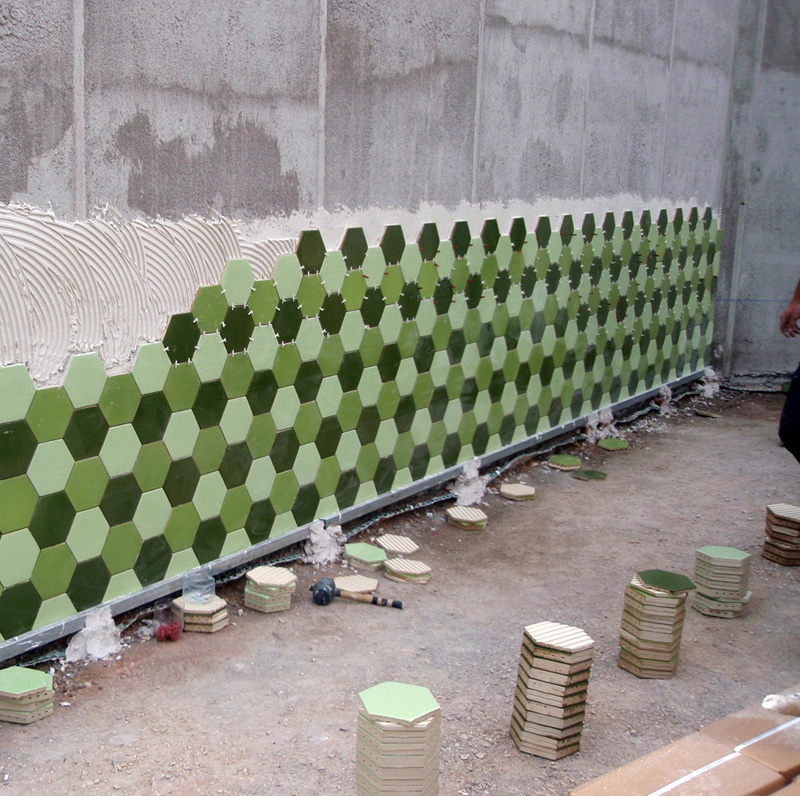 An Administrative Building In Spain Is Covered In Thousands Of Green Hexagonal Tiles