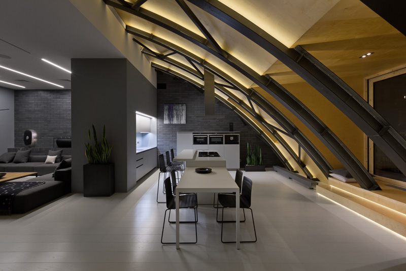 This modern apartment interior has a decorative ceiling element with hidden lighting. #ApartmentDesign #Ceiling #Lighting