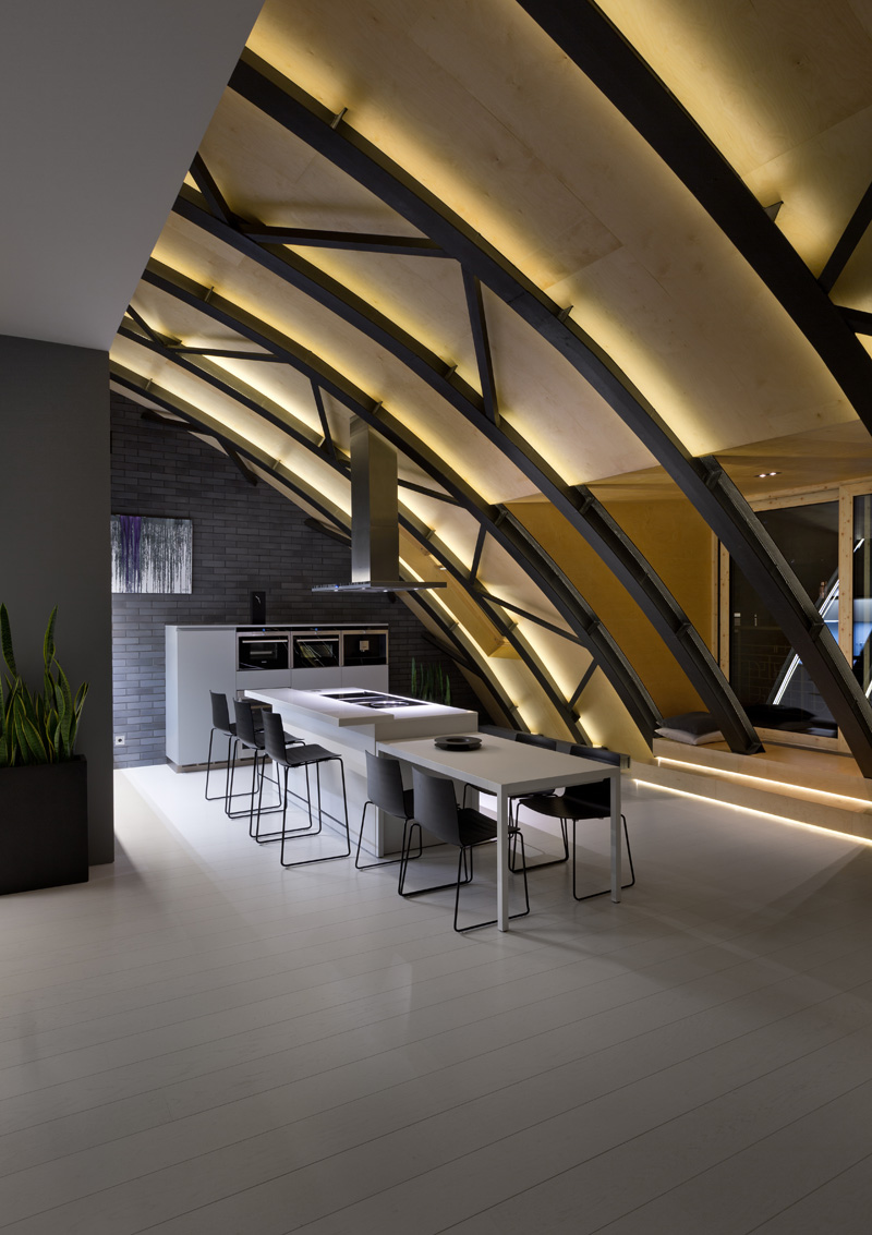 This modern apartment interior has a decorative ceiling element with hidden lighting. #ApartmentDesign #Ceiling #Lighting