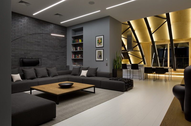 This modern apartment interior has a decorative ceiling element with hidden lighting. #ApartmentDesign #Ceiling #Lighting