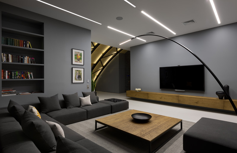 This modern apartment interior has a decorative ceiling element with hidden lighting. #ApartmentDesign #Ceiling #Lighting