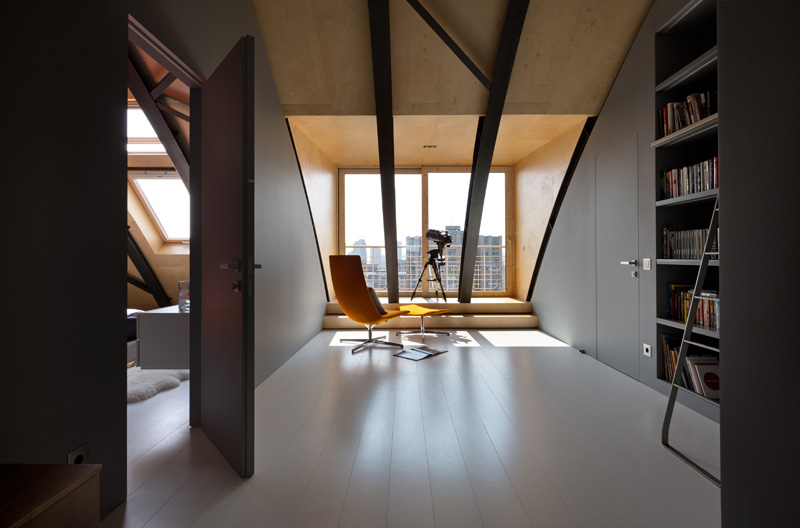 This modern apartment interior has a decorative ceiling element with hidden lighting. #ApartmentDesign #Ceiling #Lighting