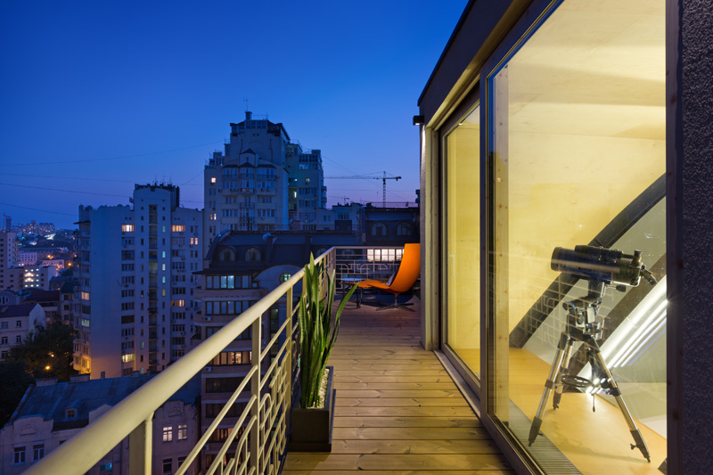 This modern apartment has a balcony that shows off the views of the city. #Balcony