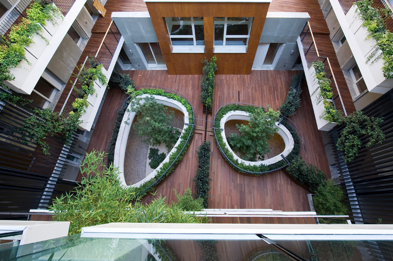 Trees Grow Through Two Elliptical Eyes Of A Suspended Garden At