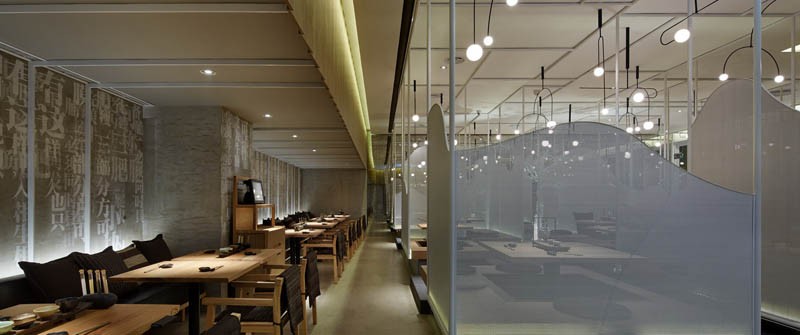 Guests at this restaurant sit on floating platforms among fog covered walkways