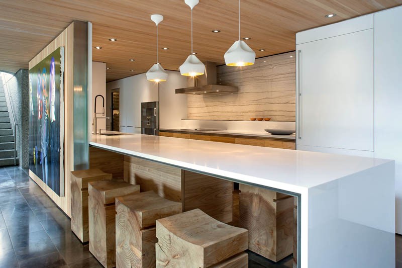 A contemporary wood and white kitchen