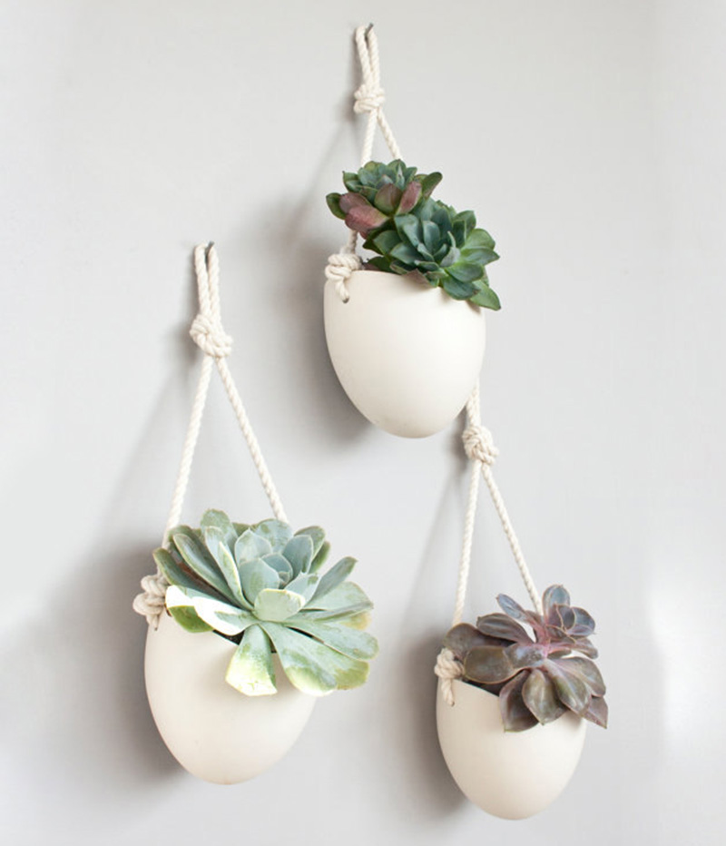 Porcelain and cotton rope hanging planters, like these designed by Light+Ladder, can be used to decorate a plain wall.  #Planters #SmallPlanters #Plants #Decor #HomeDecor #GiftIdea