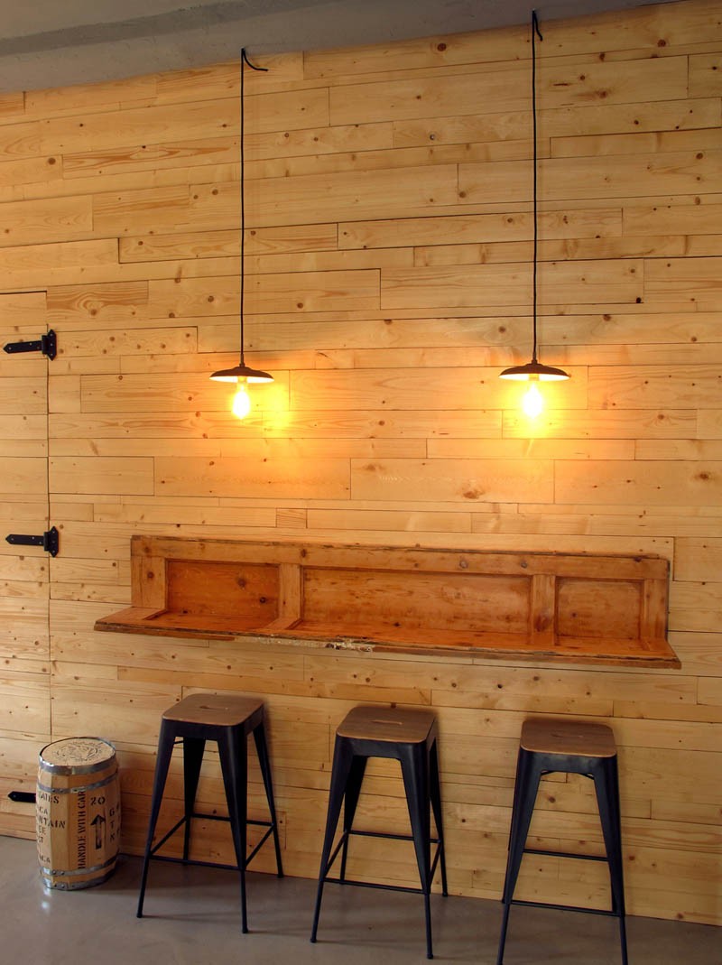 Old doors were repurposed into countertops along the wall