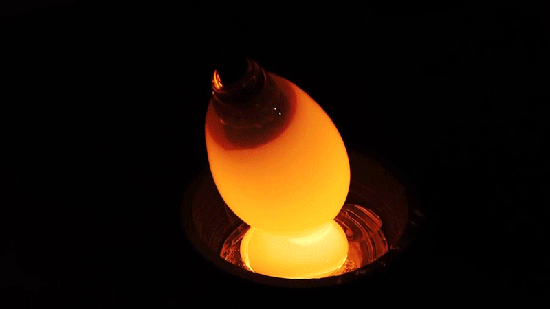 Watch how this bulging glass lamp is made