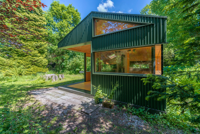 A small cabin with sliding doors and plenty of windows.