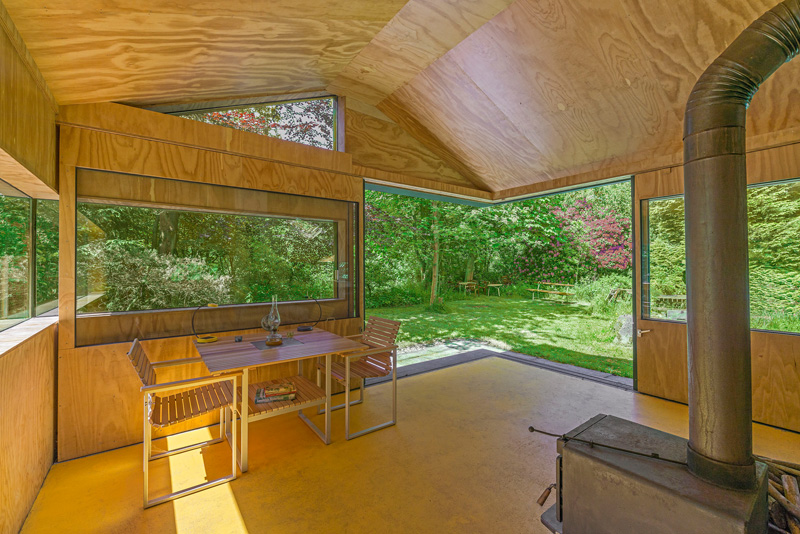 A small wood-lined cabin.