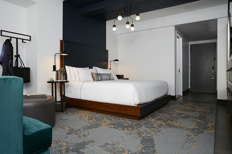 Design Detail - The headboards and paintwork in this hotel suite, are designed to define the space for the bed.