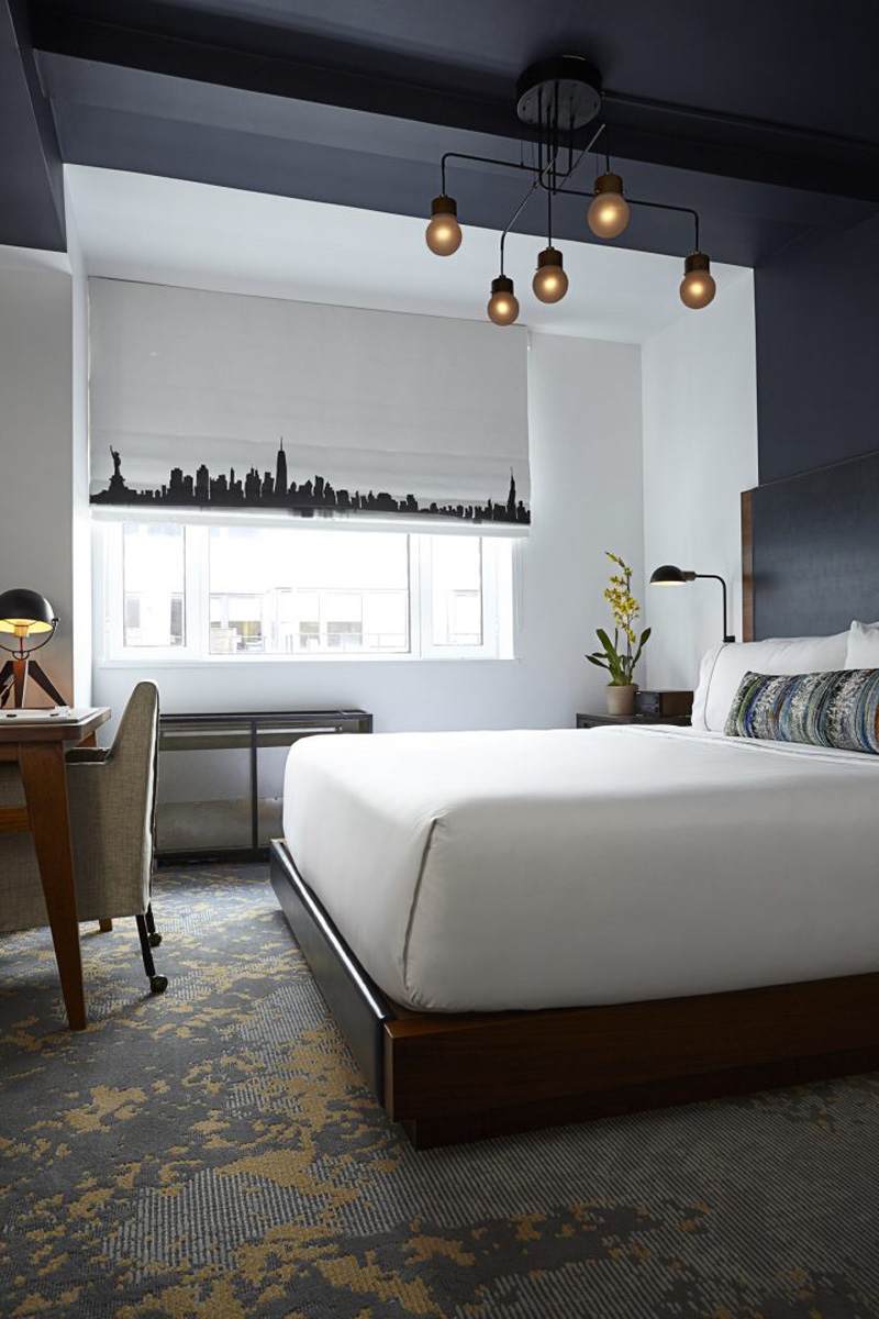 Design Detail - The headboards and paintwork in this hotel suite, are designed to define the space for the bed.