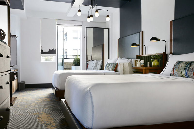 Design Detail - The headboards and paintwork in this hotel suite, are designed to define the space for the bed.