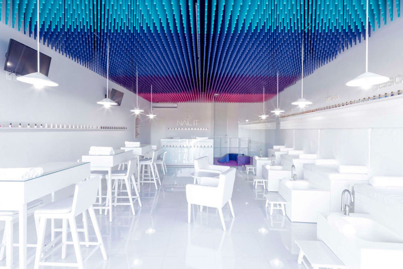 Colorful sticks hang from the ceiling of this nail salon