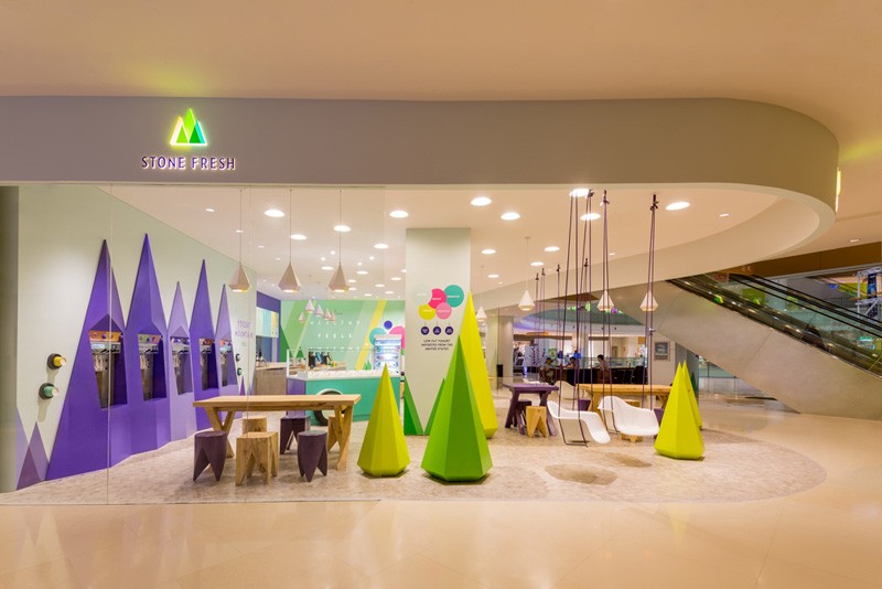 A playful theme of abstract trees and mountains were designed for this frozen yogurt shop