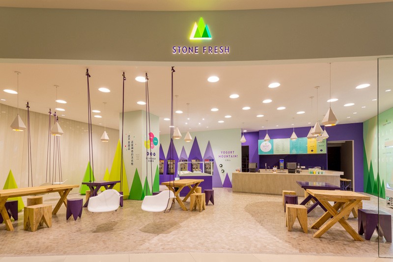 A playful theme of abstract trees and mountains were designed for this frozen yogurt shop