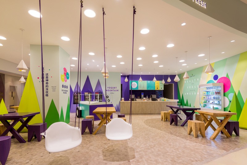 A playful theme of abstract trees and mountains were designed for this frozen yogurt shop