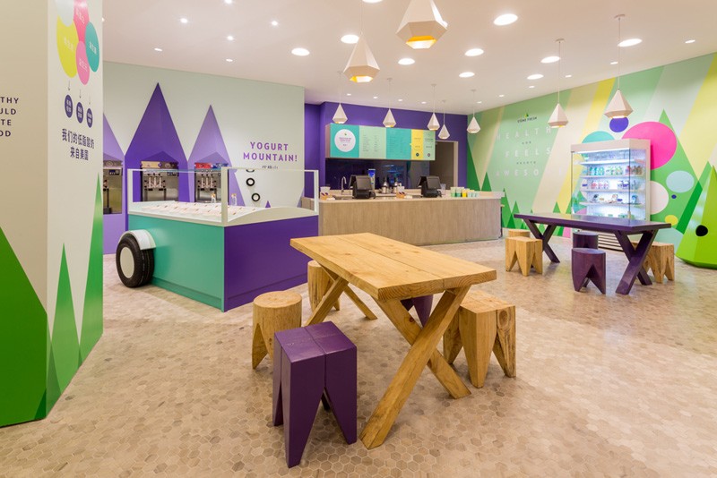 A playful theme of abstract trees and mountains were designed for this frozen yogurt shop