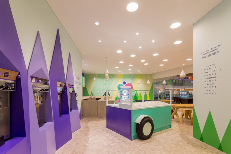 A playful theme of abstract trees and mountains were designed for this frozen yogurt shop