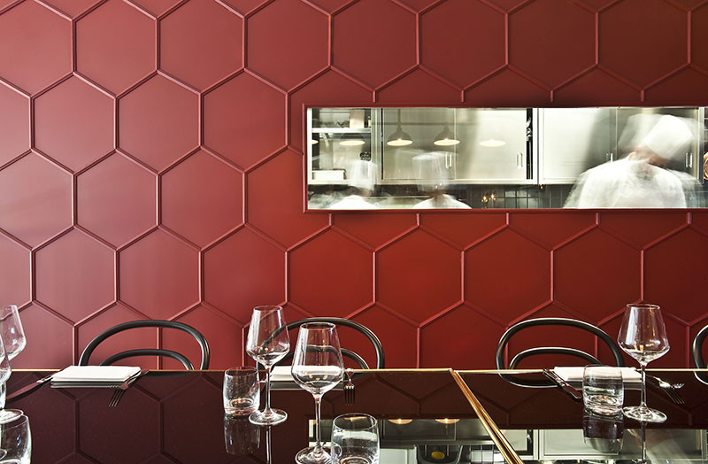 Moulding was used to create a 3D honeycomb pattern on this restaurant’s walls