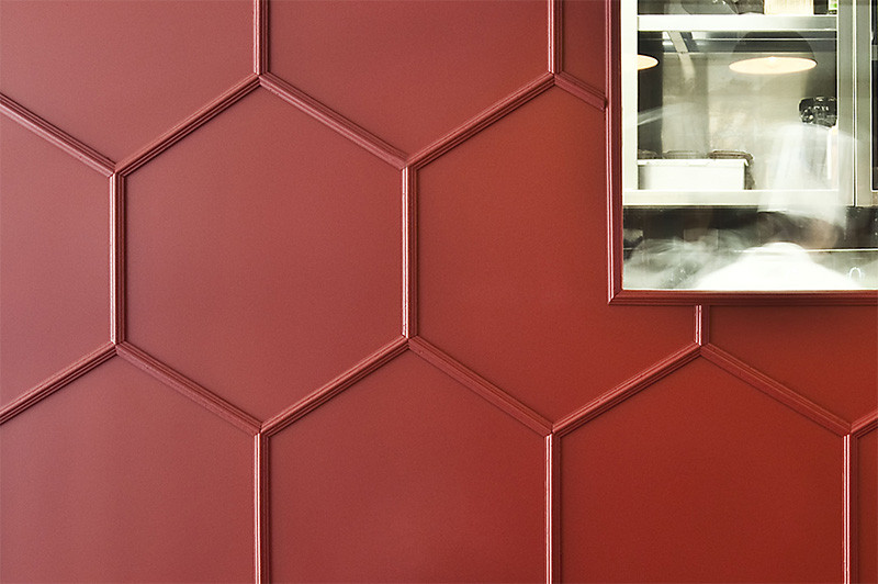 Moulding was used to create a 3D honeycomb pattern on this restaurant’s walls