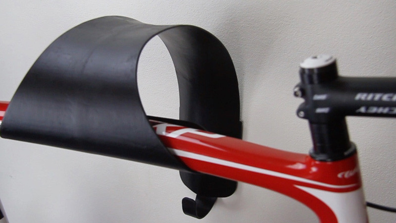 This sculptural bike wall mount is designed to showcase your ride like a work of art