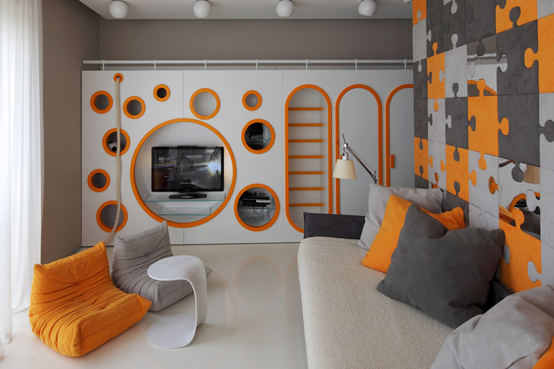 This colourful children's bedroom has a custom-built, multi-functional wall unit