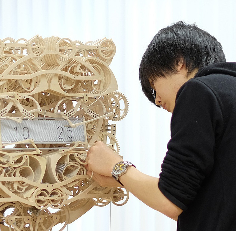 This Wooden Clock Literally Writes The Time