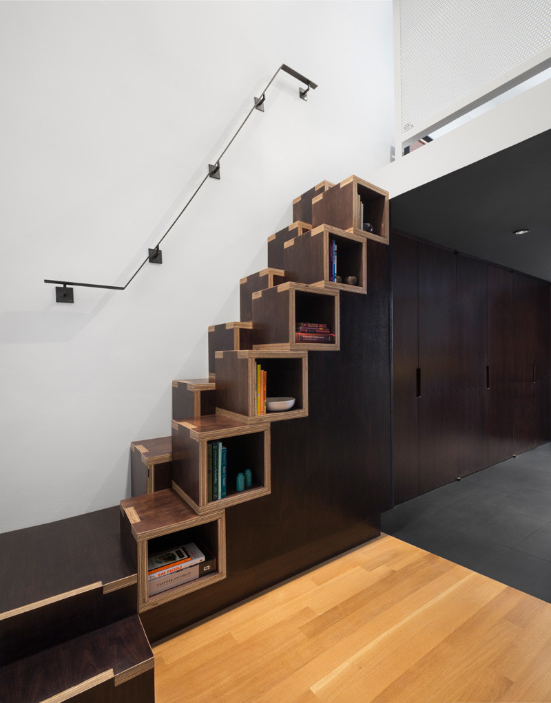 8 examples of stairs that do double-duty as bookshelves