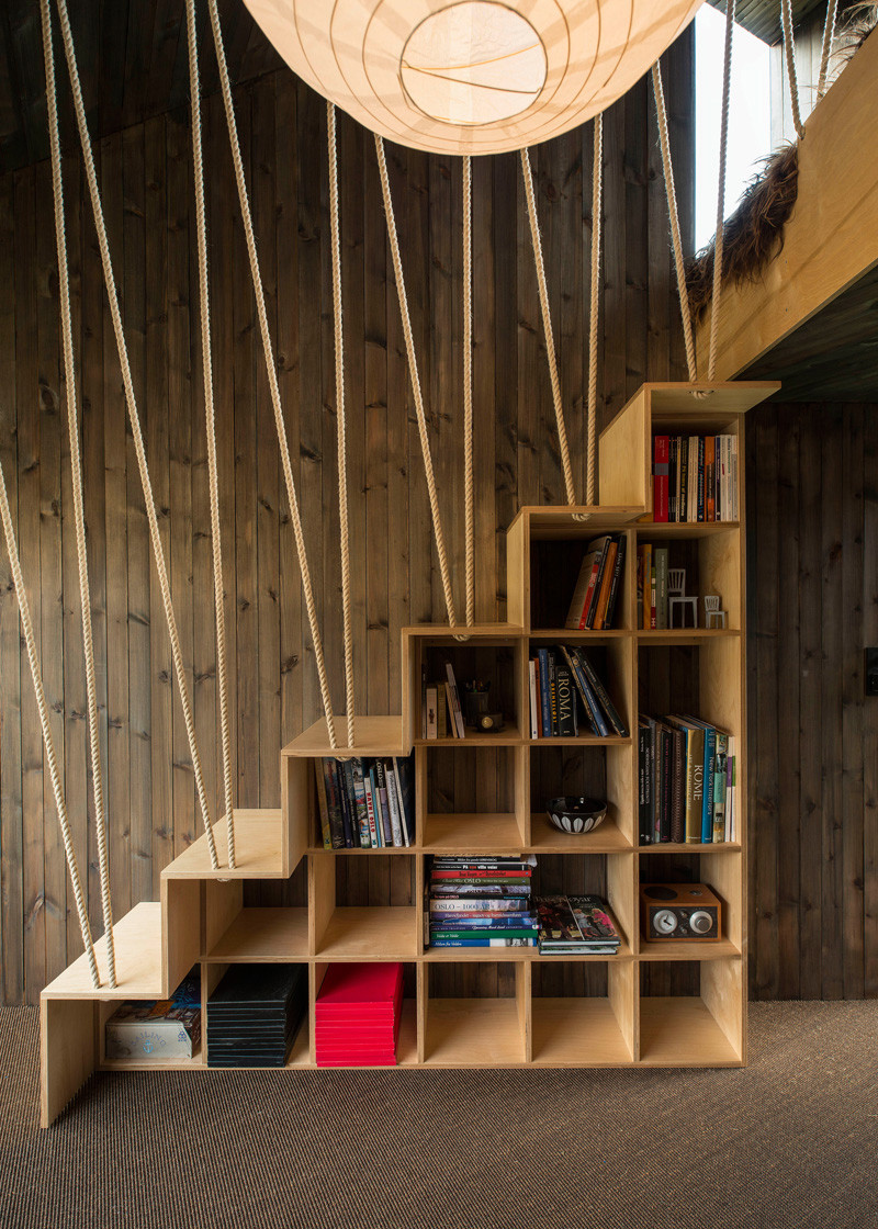 8 examples of stairs that do double-duty as bookshelves