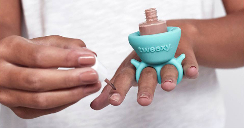 The design of this wearable nail polish holder makes painting your nails easier