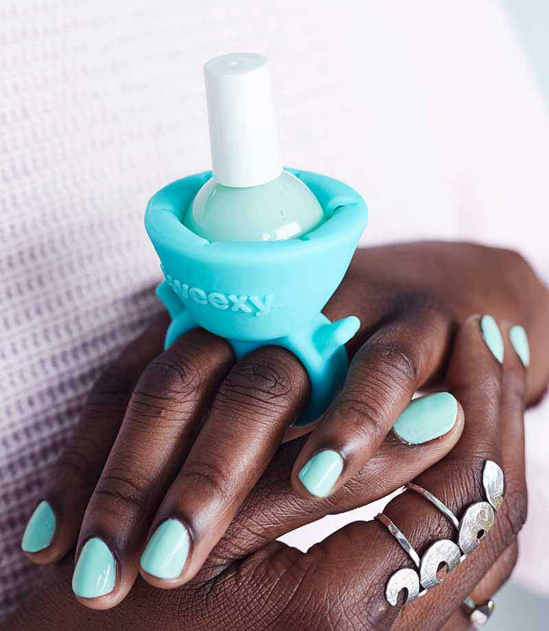 The design of this wearable nail polish holder makes painting your nails easier