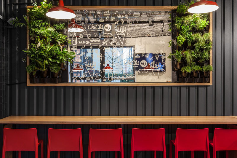 Design detail - The walls of this burger bar are covered in black corrugated steel