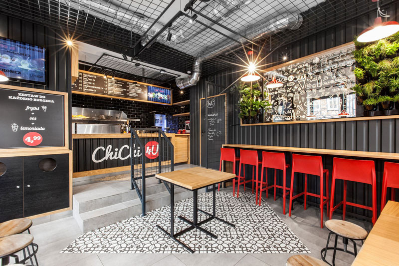 Design detail - The walls of this burger bar are covered in black corrugated steel