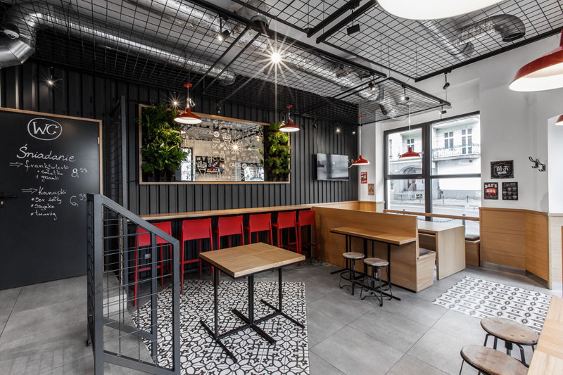 Design detail - The walls of this burger bar are covered in black corrugated steel