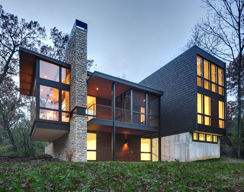 A new contemporary house in Wisconsin is covered in stone and shingles