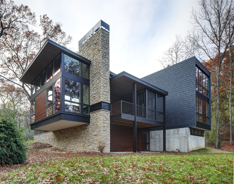 A new contemporary house in Wisconsin is covered in stone and shingles