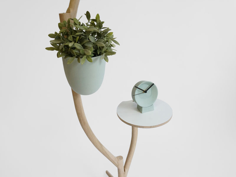 This whimsical piece of furniture is a lamp, table and flowerpot in one