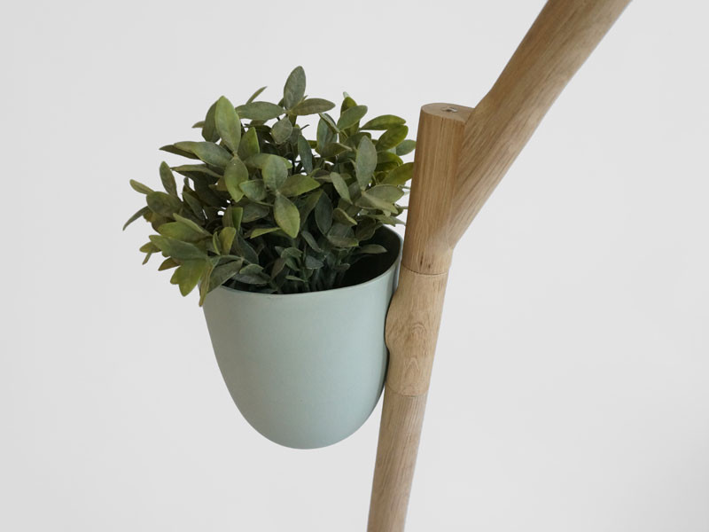 This whimsical piece of furniture is a lamp, table and flowerpot in one